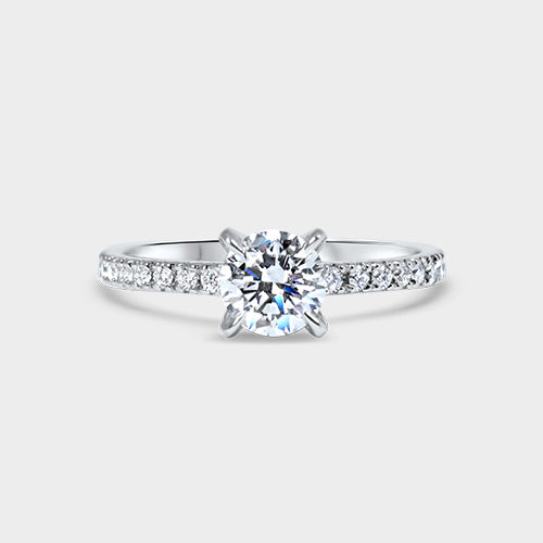 Anillo platino solitario acompañado brillante 0.8 ct con grifas