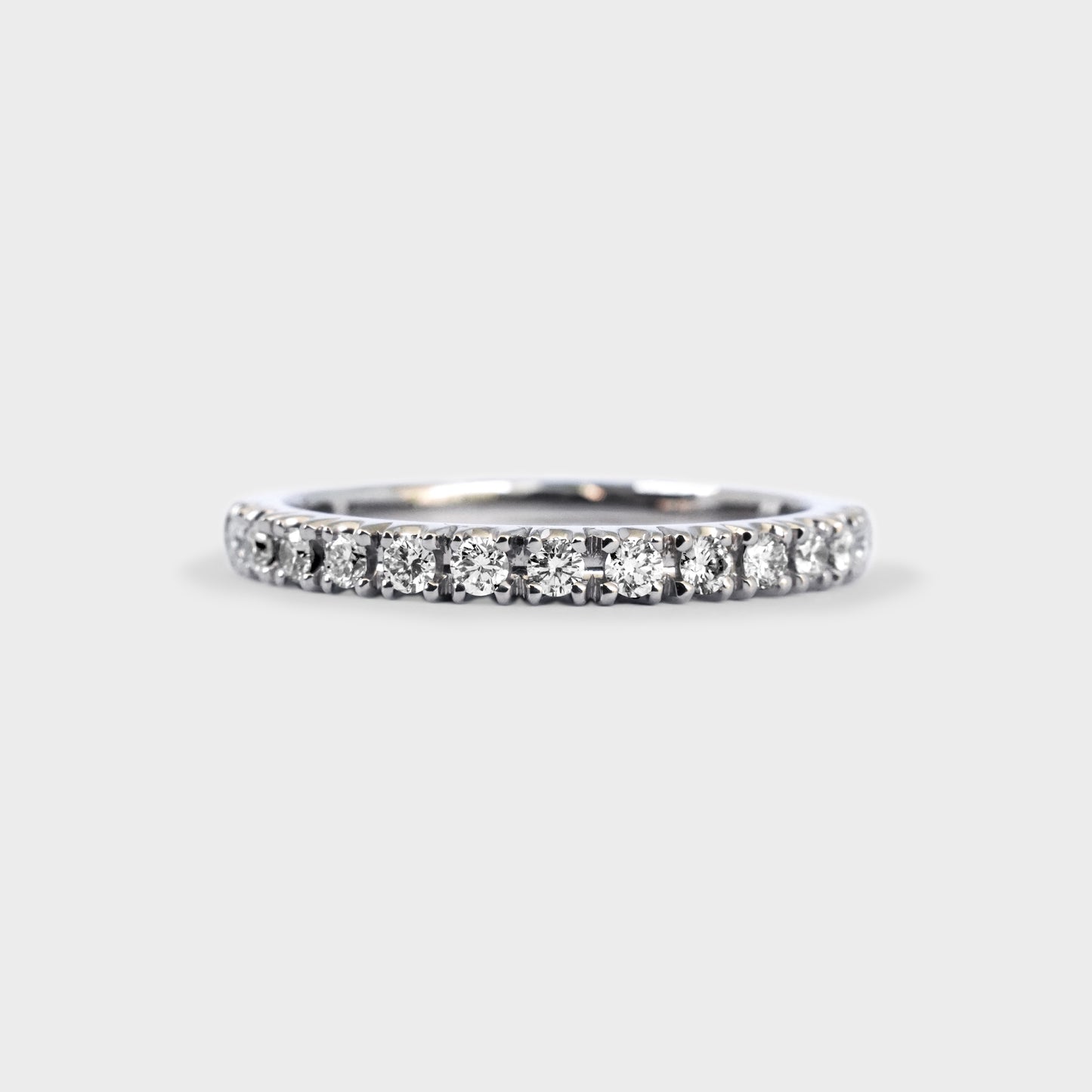 Medio cintillo oro blanco grifas 0.28ct