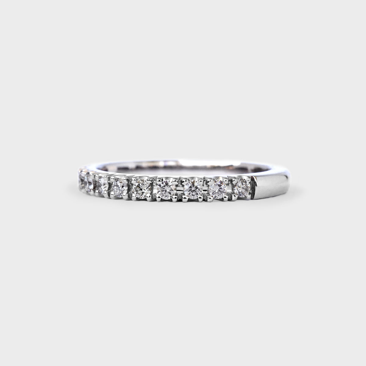 Medio cintillo oro blanco grifas 0.28ct