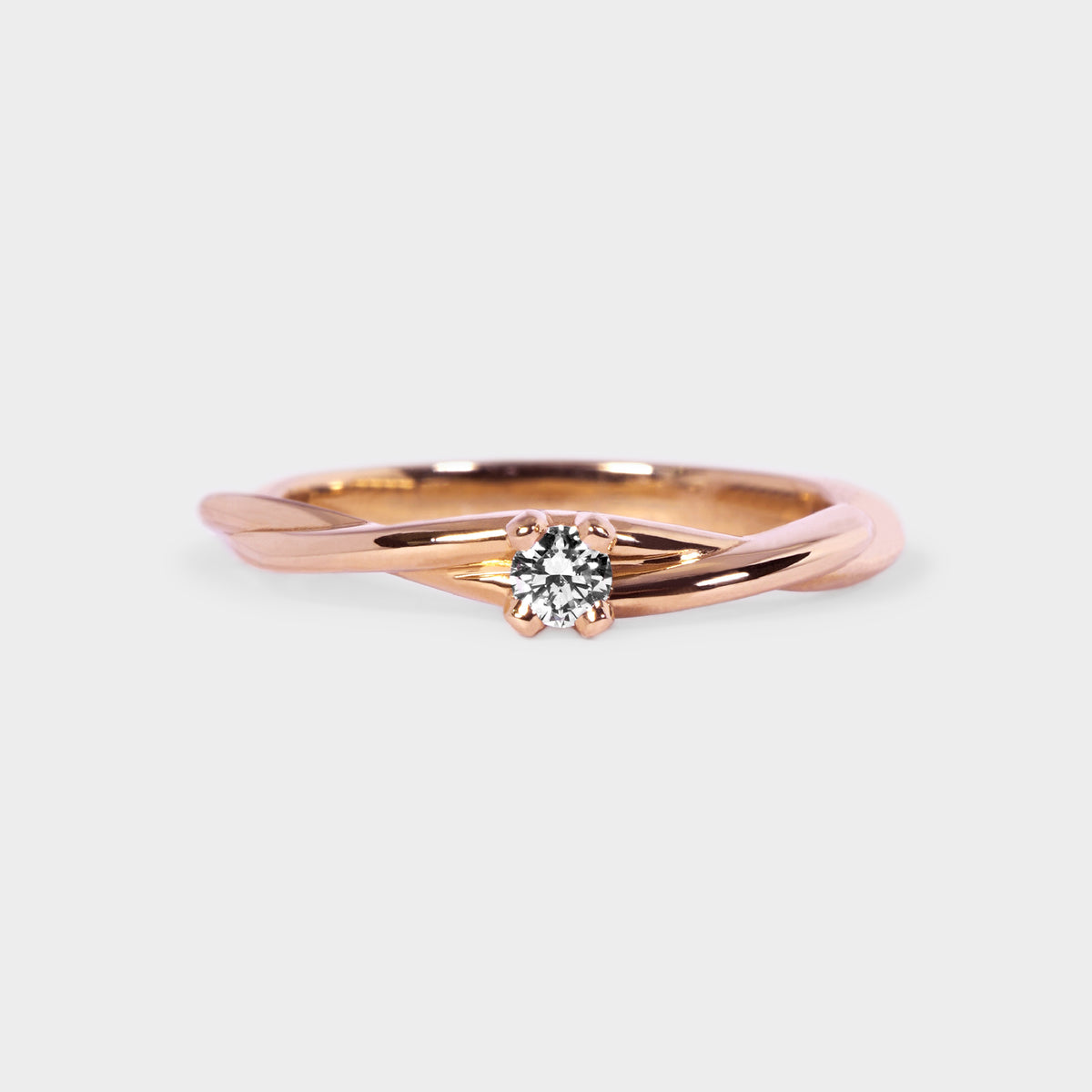 Anillo trenza solitario oro rosado